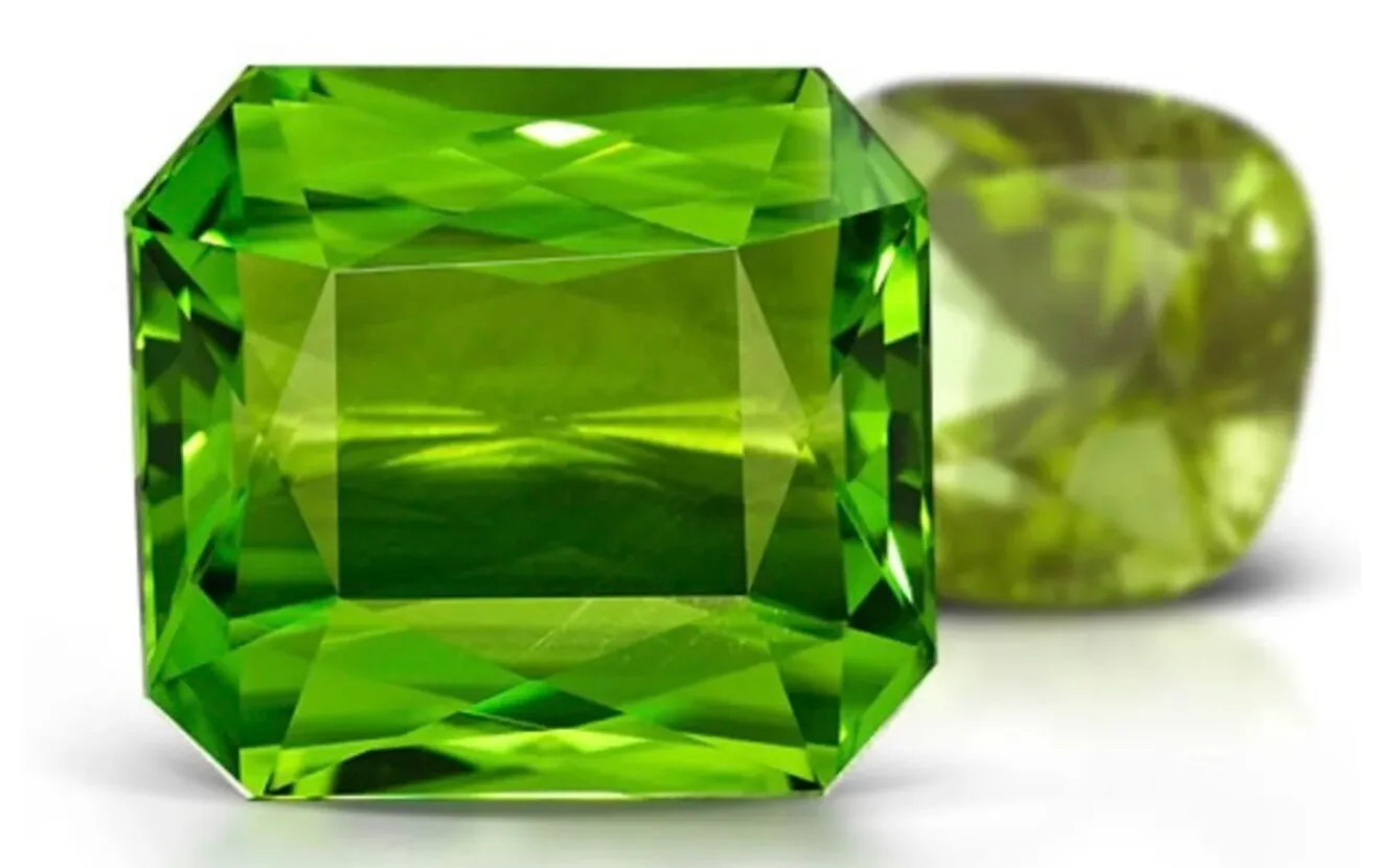 Rough and faceted peridot