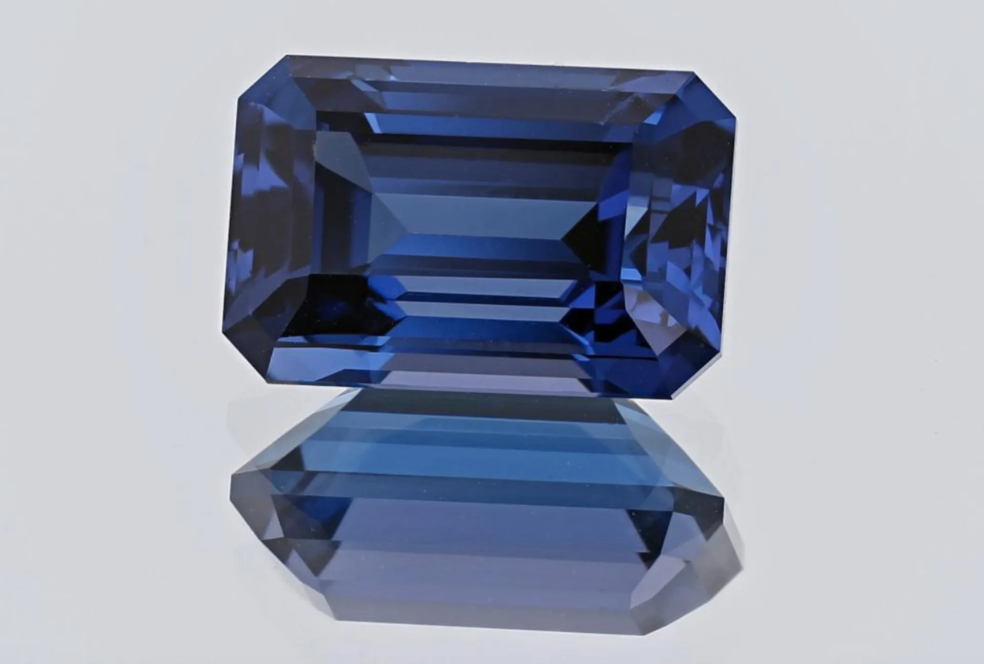 Rough and faceted tanzanite